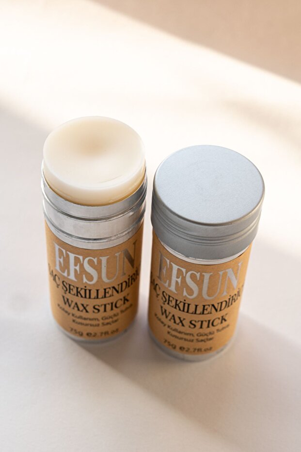 Two wax sticks with visible branding on a light background