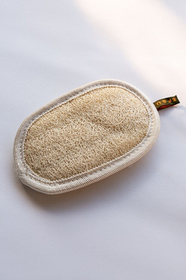 Loofah pad on a white background